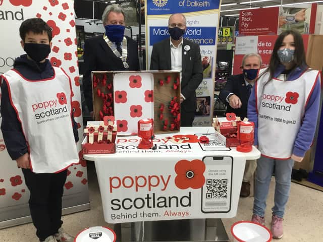 Pictured is Dakeith Rotary president Clark Watson (left) with Tesco Hardengreen manager Marc Welch, Rotarian Albert Jaster and store visitors Findlay and Kirsty.