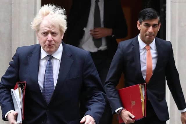 Chancellor Rishi Sunak (right) alongside Prime Minister Boris Johnson. Picture: Jonathan Brady/PA
