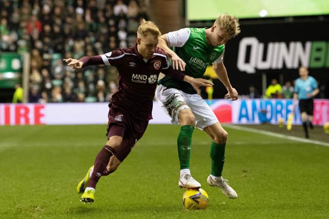 Nathaniel Atkinson battles against Josh Doig in the last Edinburgh derby between Hearts and Hibs at Easter Road. Picture: SNS