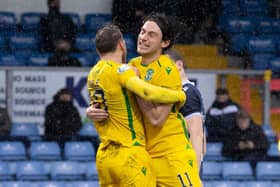 Joe Newell celebrates with Martin Boyle after the equaliser