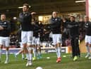 The Hibs team warm up before the Scottish Cup tie with Motherwell at Fir Park. Picture: SNS