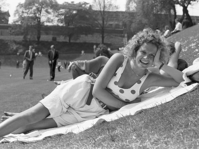 Jackie Murphy tops up her tan, sunbathing in Princes Street Gardens during the warm weather in May 1989.