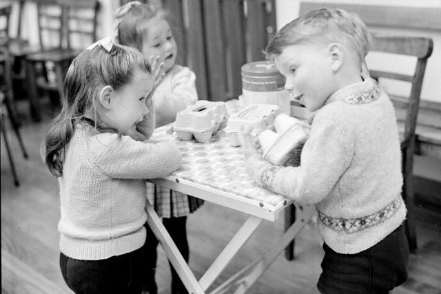 James Murray (right) plays shop, selling eggs to fellow playmates at the Salvation Army Nursery on Gorgie Road, Edinburgh, April 25 1968.