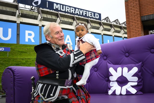 Nine-month old Esther Addison-Onwuka with grandad Norman Fiddes at this year's Edinburgh Kiltwalk.  As co-headline sponsor of Kiltwalk, Royal Bank of Scotland gave weary walkers a well-deserved rest with a giant chair installation set up in the Kiltwalk village surrounding Scottish Gas Murrayfield stadium.