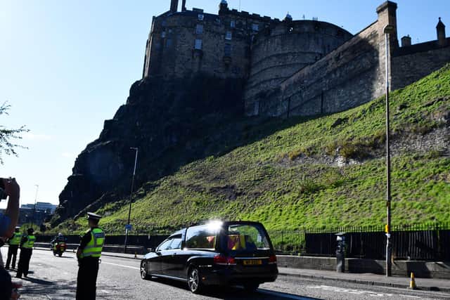 The Queen leaves Edinburgh for the last time departing St Giles' Cathedral to travel along Johnston Terrace, past Edinburgh Castle and on to Edinburgh Airport. Picture: Michael Gillen