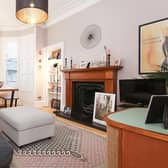 The flat’s characterful living room boasts many traditional features