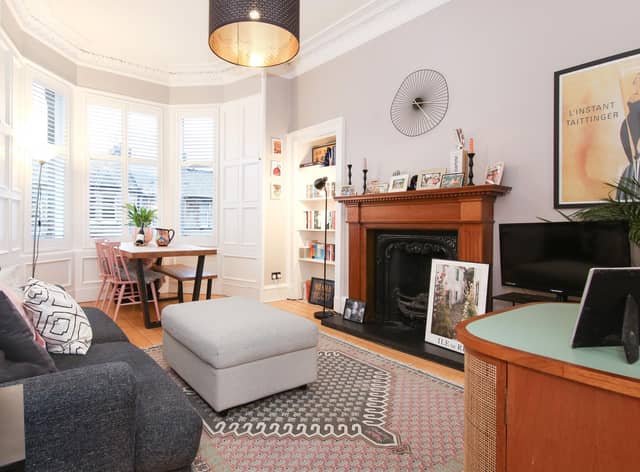 The flat’s characterful living room boasts many traditional features