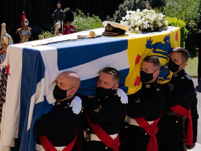The Duke of Edinburgh's coffin, covered with his Personal Standard, being carried into St George's Chapel, Windsor Castle, Berkshire.