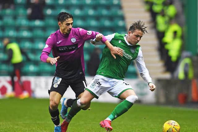 Hibs midfielder Scott Allan holds off St Mirren winger Ilkay Durmus during the last meeting between the two teams at Easter Roa in February