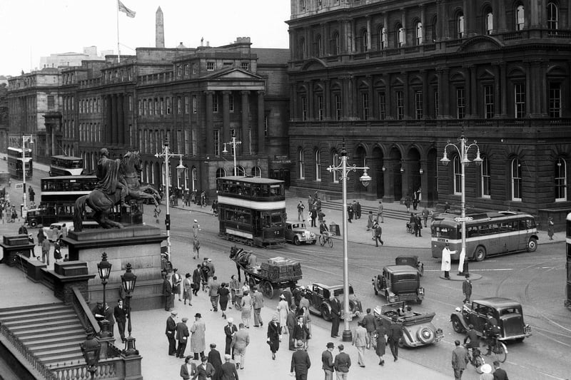 This 1940s view of the Waterloo Place and the GPO building from Register House at the East End of Princes Street shows how people of Edinburgh used all methods of transport - trams, buses, cars, horse and cart and bicycles.