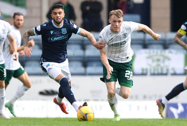 Jake Doyle-Hayes looks to get away from Dundee's Declan McDaid during the 2-2 draw at Dens Park
