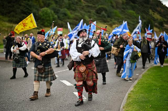 Pipers set the tone at the march. (Photo by Jeff J Mitchell/Getty Images)