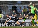Hibs keeper Matt Macey comes for a late cross during his side's win over St Mirren. Picture: SNS