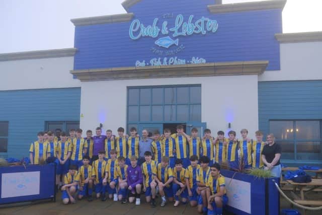 The team is pictured with Sarah and Juan from the restaurant
