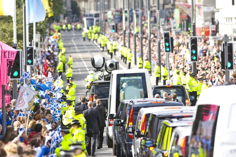 The motorcade, with Pope Benedict XVI in the Popemobile, made its way through the city centre, along the full length of Princes Street, and up Lothian Road, cheered by well-wishers waving saltires.  This is the view along Princes Street from the Royal Scottish Academy at the Mound.