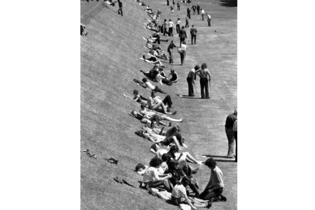 Crowds enjoying the sunshine at the former putting green in East Princes Street Gardens, in Edinburgh, in 1976.