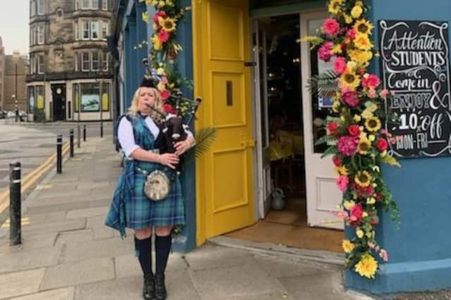 City's piper Lou Marshall welcomes customers to Piecebox
