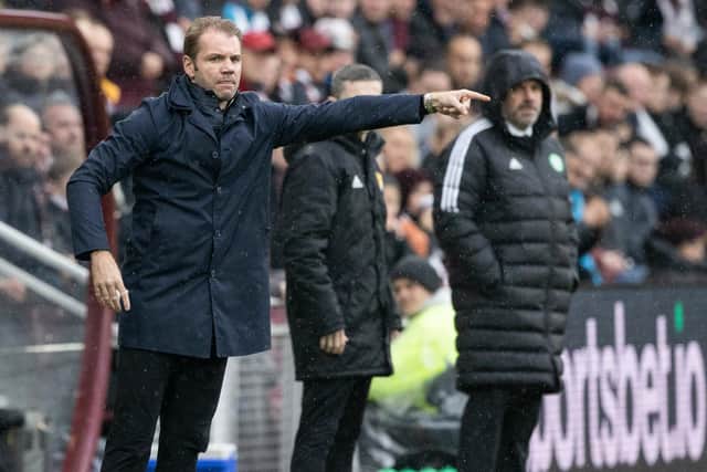 Hearts manager Robbie Neilson with Celtic's Ange Postecoglou in the background.