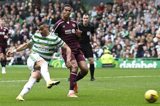 Toby Sibbick challenges Celtic's Giorgos Giakoumakis during the 4-1 defeat suffered by Hearts the last time they travelled to Parkhead. Picture: SNS