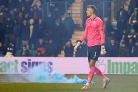 Flares were thrown onto the pitch near goalkeeper Matt Macey during Wednesday’s match between Hibs and Rangers at Easter Road