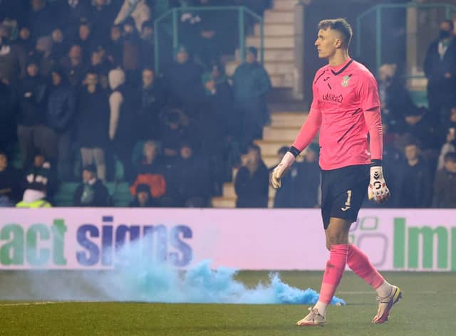 Flares were thrown onto the pitch near goalkeeper Matt Macey during Wednesday’s match between Hibs and Rangers at Easter Road