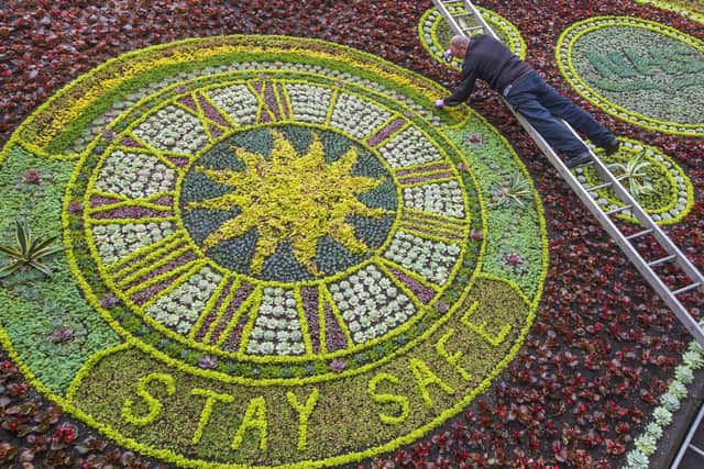 David Dorward, Head gardener for Edinburgh City Council puts the final touches to Princes Street Gardens Floral Clock. Paying tribute to Key Workers and the NHS. June 15 2020