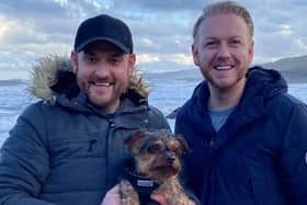 Husbands Kevin and Kevin with their beloved dog Alfie who died