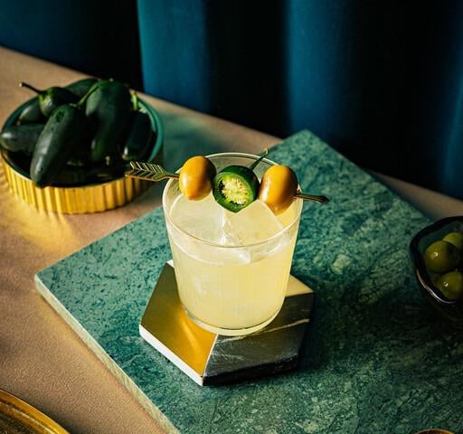 Tommy Verde, which uses tequila, mezcal, cucumber agave, olive brine, green tabasco, and green tomato juice, is complex and vegetal, with a hint of smoke.