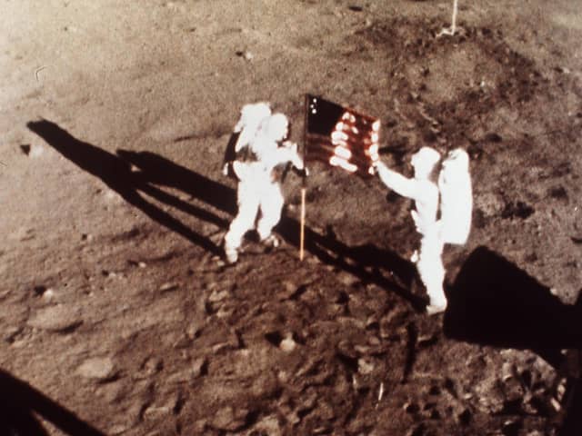 On July 20, 1969 Apollo 11 astronauts Neil Armstrong and Edwin E. 'Buzz' Aldrin, the first men to land on the moon, plant the US flag on the lunar surface
