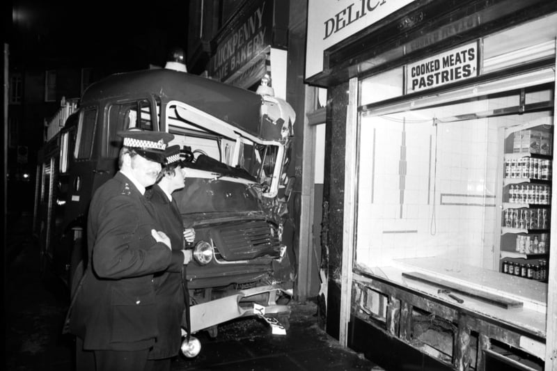 Police attended after a fire engine crashed into the front of a shop in Deanhaugh Road, Stockbridge Edinburgh, in January 1979.