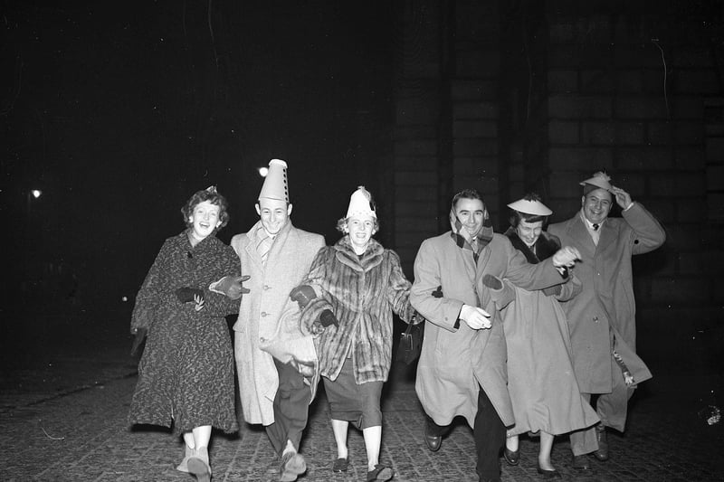 Hogmanay scene at the Tron Church Edinburgh, six Americans dance down High Street 