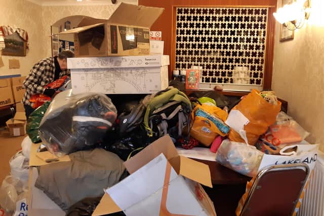 The basement rooms of the club are filled with donations.