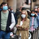 The UK’s Covid-19 alert level has been lowered as the country’s top medics said the threat of the NHS being overwhelmed has receded.