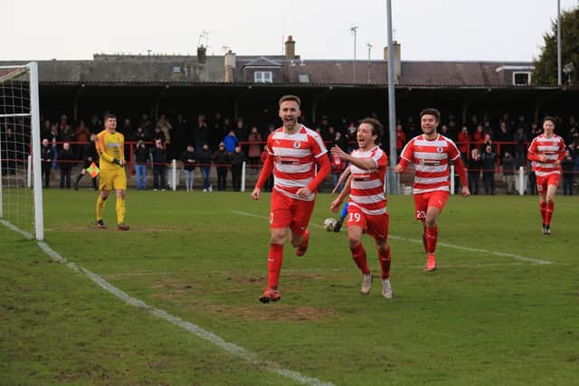 Celebrations for Bonnyrigg after Neil Martyniuk breaks the deadlock from the penalty spot against Bo’ness United last Saturday. Picture: Joe Gilhooley