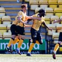 Ayo Obileye (centre) celebrates with his Livingston team-mates after scoring the late goal which defeated Hibs at the Tony Macaroni Arena. Picture: SNS