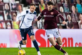Hearts midfielder Andy Irving battles Gavin Swankie for possession during his side's 3-1 win over Arbroath. Picture: SNS