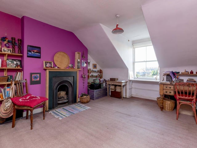 Another large double bedroom, complete with fireplace.