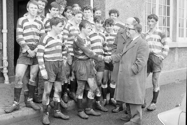 The Royal High School rugby team are congratulated on their 100 per cent winning record by Mr W Emble in March 1964.