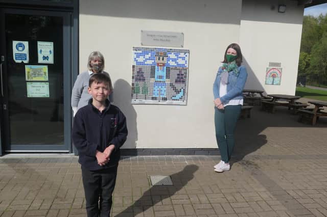 Finlay McFaul (P4) at front with his gran Mary Blair on the back left and Elinor Fox on the right. Mary is chair of Dalkeith Arts and she made her grandson’s design.