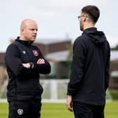 Hearts manager Steven Naismith with one of the club's backroom staff at Riccarton.