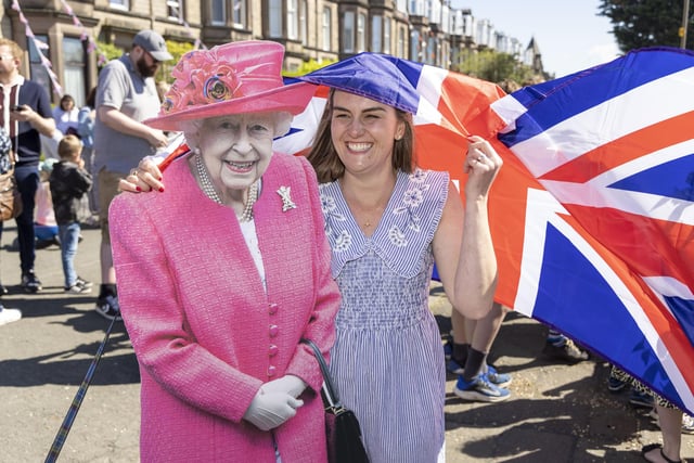 Jenny Quinn poses with a cardboard cutout of the Queen as residents of Netherby Drive in Trinity celebrate the Platinum Jubilee. (Photo by Robert Perry/Getty Images)