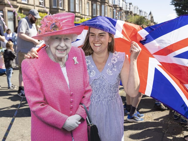 Jenny Quinn poses with a cardboard cutout of the Queen as residents of Netherby Drive in Trinity celebrate the Platinum Jubilee. (Photo by Robert Perry/Getty Images)
