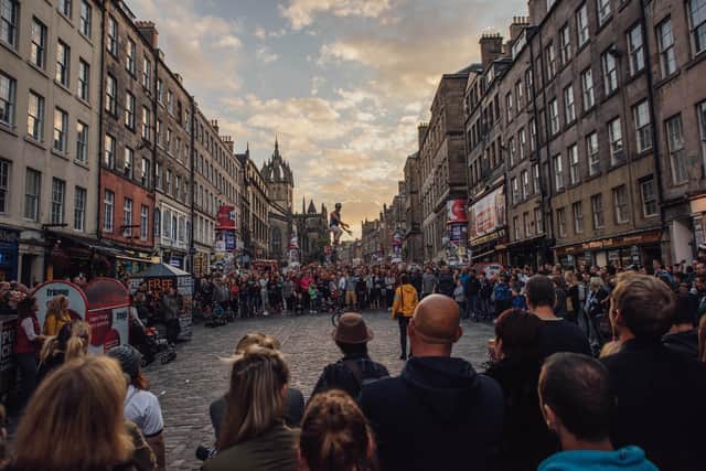 The Royal Mile attracts huge crowds for free street theatre each summer. Picture: David Monteith-Hodge