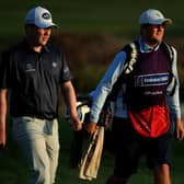 Bob MacIntyre and caddie Mikey Thompson walk on the 10th in the second round of the Omega Dubai Desert Classic at Emirates Golf Club. Picture: Andrew Redington/Getty Images.
