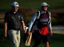 Bob MacIntyre and caddie Mikey Thompson walk on the 10th in the second round of the Omega Dubai Desert Classic at Emirates Golf Club. Picture: Andrew Redington/Getty Images.