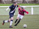 Civil Service Strollers captain Mark McConnell gets ahead of Phil Addison of Gala Fairydean Rovers