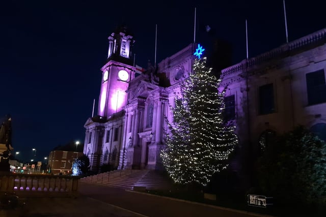The Town Hall is lit purple and a big Christmas tree feel very festive.