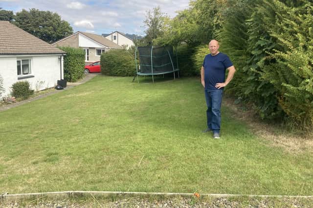 Jimmy Scally in his garden, where he hopes to build a bungalow to house his adult children.