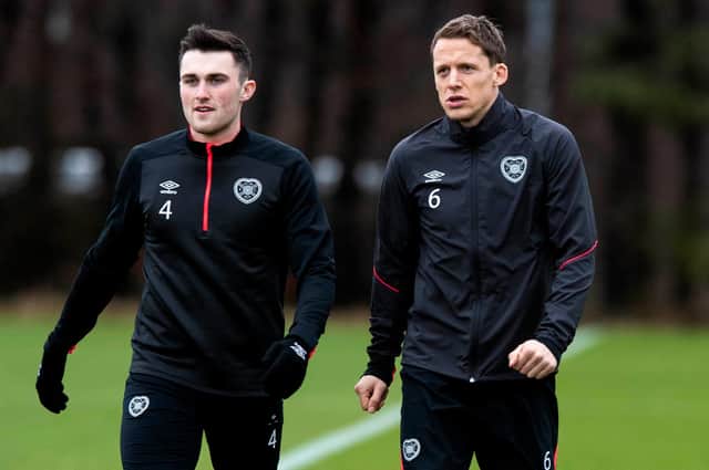 Christophe Berra, right, saw the injury nightmare John Souttar, left had to go through three times at Hearts