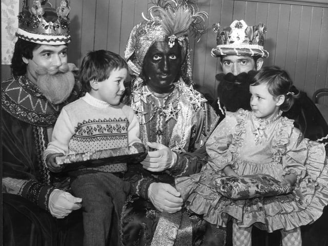 The Association of Spanish Parents organised the Christmas Nativity at the Calton Centre in 1985. Antonio Lopez (5) and Michelle Roncero (3) are pictured getting presents.
